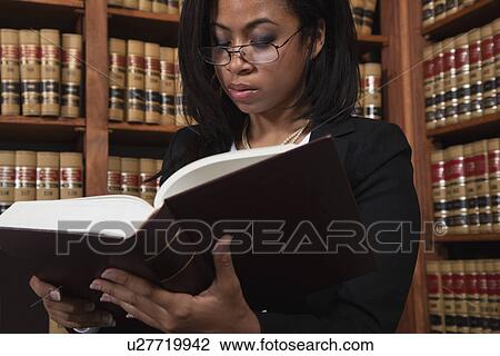USA, California, Oakland, Woman reading books in library View Large Photo Image Stock Image - USA, California, Oakland, Woman reading books in library. Fotosearch