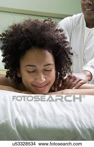 USA, California, Oakland, young woman having back massage View Large Photo Image Picture - USA, California, Oakland, young woman having back massage. Fotosearch
