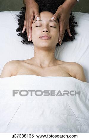 USA, California, Oakland, young woman having head massage View Large Photo Image Stock Photography - USA, California, Oakland, young woman having head massage. Fotosearch