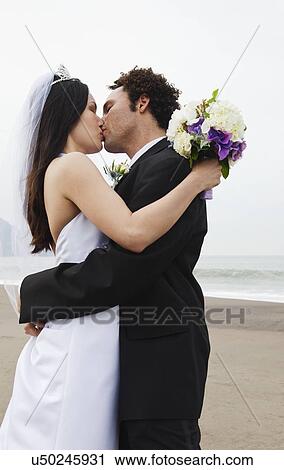USA, California, San Francisco, Baker Beach, bride and groom kissing on beach View Large Photo Image Stock Image - USA, California, San Francisco, Baker Beach, bride and groom kissing on beach. Fotosearch