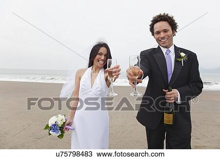USA, California, San Francisco, Baker Beach, bride and groom toasting on beach View Large Photo Image Stock Image - USA, California, San Francisco, Baker Beach, bride and groom toasting on beach. Fotosearch