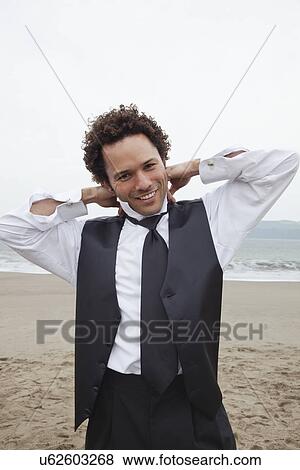 USA, California, San Francisco, Baker Beach, portrait of groom on beach View Large Photo Image Stock Photo - USA, California, San Francisco, Baker Beach, portrait of groom on beach. Fotosearch