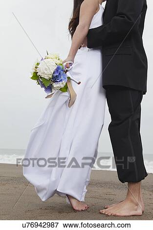 USA, California, San Francisco, Baker Beach, bride and groom walking on beach View Large Photo Image Stock Photo - USA, California, San Francisco, Baker Beach, bride and groom walking on beach. Fotosearch
