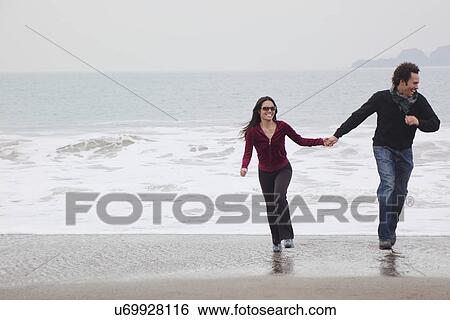 USA, California, San Francisco, Baker Beach, couple walking on beach View Large Photo Image Stock Photograph - USA, California, San Francisco, Baker Beach, couple walking on beach. Fotosearch