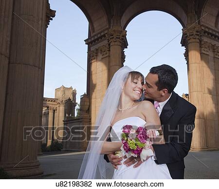 USA, California, San Francisco, bride and groom embracing under arches View Large Photo Image Stock Image - USA, California, San Francisco, bride and groom embracing under arches. Fotosearch
