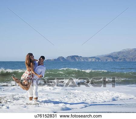 USA, California, San Francisco, couple playing on Baker Beach View Large Photo Image Stock Image - USA, California, San Francisco, couple playing on Baker Beach. Fotosearch