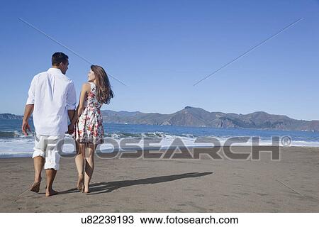 USA, California, San Francisco, couple walking on Baker Beach View Large Photo Image Stock Image - USA, California, San Francisco, couple walking on Baker Beach. Fotosearch
