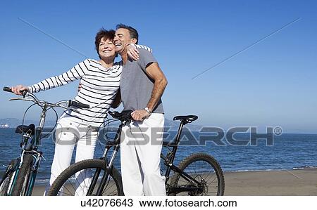 USA, California, San Francisco, Elder couple cycling on beach View Large Photo Image Stock Image - USA, California, San Francisco, Elder couple cycling on beach. Fotosearch