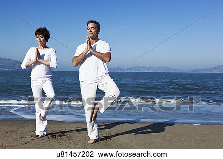 USA, California, San Francisco, Elder couple practicing yoga on beach View Large Photo Image Stock Image - USA, California, San Francisco, Elder couple practicing yoga on beach. Fotosearch