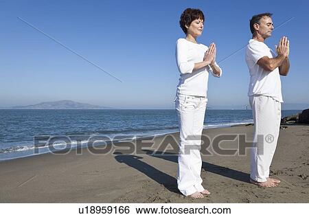 USA, California, San Francisco, Elder couple practicing yoga on beach View Large Photo Image Stock Photograph - USA, California, San Francisco, Elder couple practicing yoga on beach. Fotosearch