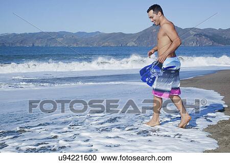 USA, California, San Francisco, man carrying flippers on Baker Beach View Large Photo Image Stock Image - USA, California, San Francisco, man carrying flippers on Baker Beach. Fotosearch