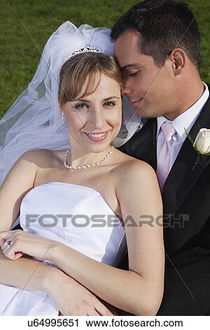 USA, California, San Francisco, portrait of bride and groom embracing View Large Photo Image Stock Image - USA, California, San Francisco, portrait of bride and groom embracing. Fotosearch