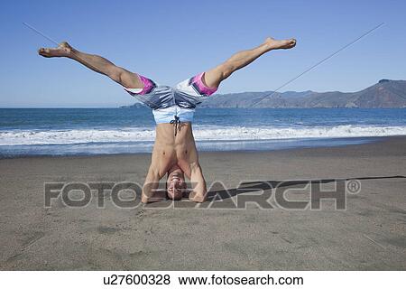 USA, California, San Francisco, portrait of man performing head stand on Baker Beach View Large Photo Image Stock Photo - USA, California, San Francisco, portrait of man performing head stand on Baker Beach. Fotosearch