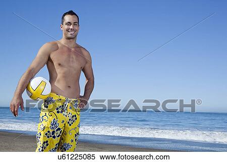 USA, California, San Francisco, portrait of man holding ball on Baker Beach View Large Photo Image Stock Photography - USA, California, San Francisco, portrait of man holding ball on Baker Beach. Fotosearch