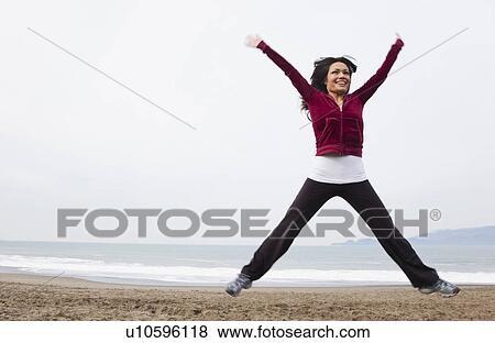 USA, California, San Francisco, woman jumping on Baker Beach View Large Photo Image Stock Photo - USA, California, San Francisco, woman jumping on Baker Beach. Fotosearch