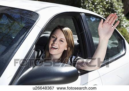 USA, California, San Rafael, teenage girl (16-17) waving from car View Large Photo Image Stock Photo - USA, California, San Rafael, teenage girl (16-17) waving from car. Fotosearch