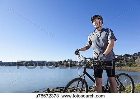 USA, California, Tiburon, Cyclist at lakeside View Large Photo Image Stock Image - USA, California, Tiburon, Cyclist at lakeside. Fotosearch
