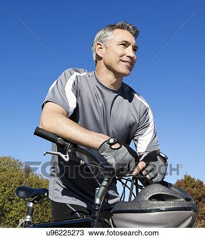 USA, California, Tiburon, Portrait of cyclist against blue sky View Large Photo Image Stock Image - USA, California, Tiburon, Portrait of cyclist against blue sky. Fotosearch