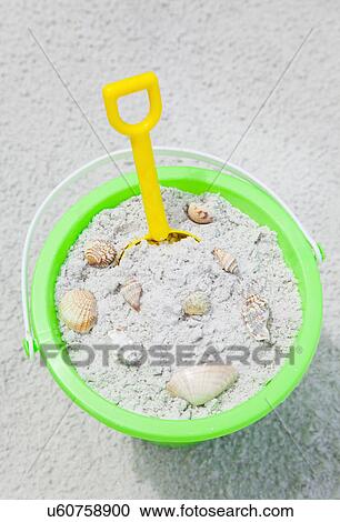 USA, Florida, St. Pete Beach, Bucket filled with sand an sea shells on beach View Large Photo Image Stock Image - USA, Florida, St. Pete Beach, Bucket filled with sand an sea shells on beach. Fotosearch
