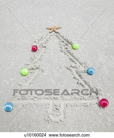 Picture - USA, Florida, St. Pete Beach, Christmas tree drawn in sand. Fotosearch