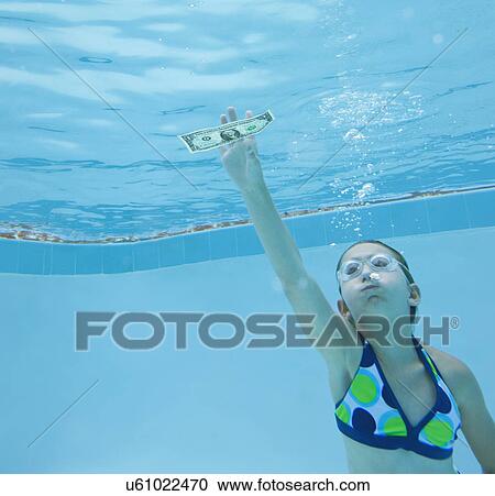 USA, Florida, St. Pete Beach, Girl (8-9) swimming in pool and reaching for one dollar banknote View Large Photo Image Stock Image - USA, Florida, St. Pete Beach, Girl (8-9) swimming in pool and reaching for one dollar banknote. Fotosearch