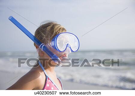 USA, Florida, St. Pete Beach, girl (8-9) in snorkeling mask on beach View Large Photo Image Stock Photo - USA, Florida, St. Pete Beach, girl (8-9) in snorkeling mask on beach. Fotosearch