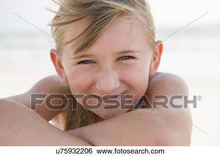 USA, Florida, St. Pete Beach, Portrait of smiling girl (8-9) on beach View Large Photo Image Stock Photograph - USA, Florida, St. Pete Beach, Portrait of smiling girl (8-9) on beach. Fotosearch