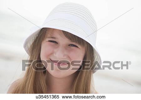 USA, Florida, St. Pete Beach, Portrait of girl (8-9) in sun hat on beach View Large Photo Image Stock Photography - USA, Florida, St. Pete Beach, Portrait of girl (8-9) in sun hat on beach. Fotosearch