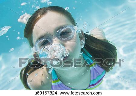 Picture - USA Florida, St. Pete Beach, Underwater shot of girl (8-9) diving. Fotosearch
