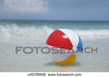 USA, Florida, St. Petersburg, beach ball floating on water View Large Photo Image Stock Photograph - USA, Florida, St. Petersburg, beach ball floating on water. Fotosearch