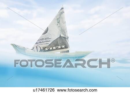 Stock Photograph - USA, Florida, St. Petersburg, Boat made of fifty dollar banknote floating on water. Fotosearch