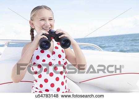 USA, Florida, St. Petersburg, Girl (10-11) on yacht holding binoculars View Large Photo Image Stock Photo - USA, Florida, St. Petersburg, Girl (10-11) on yacht holding binoculars. Fotosearch
