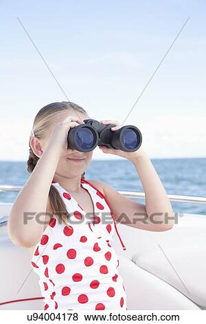 USA, Florida, St. Petersburg, Girl (10-11) on yacht looking through binoculars View Large Photo Image Stock Photo - USA, Florida, St. Petersburg, Girl (10-11) on yacht looking through binoculars. Fotosearch