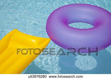USA, Florida, St. Petersburg, Inner tube and pool raft floating on water View Large Photo Image Stock Image - USA, Florida, St. Petersburg, Inner tube and pool raft floating on water. Fotosearch