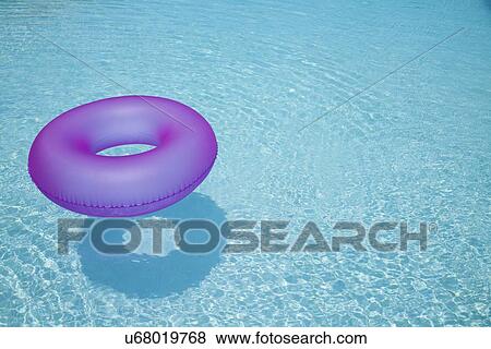 USA, Florida, St. Petersburg, Inner tube floating on water View Large Photo Image Stock Photo - USA, Florida, St. Petersburg, Inner tube floating on water. Fotosearch