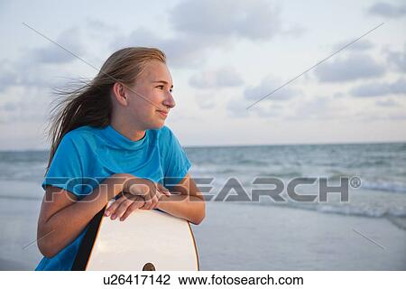 USA, Florida, St. Petersburg, portrait of girl (12-13) leaning on boogie board View Large Photo Image Stock Image - USA, Florida, St. Petersburg, portrait of girl (12-13) leaning on boogie board. Fotosearch