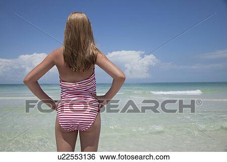 USA, Florida, St. Petersburg, rear view of girl (12-13) looking at view View Large Photo Image Stock Photograph - USA, Florida, St. Petersburg, rear view of girl (12-13) looking at view. Fotosearch
