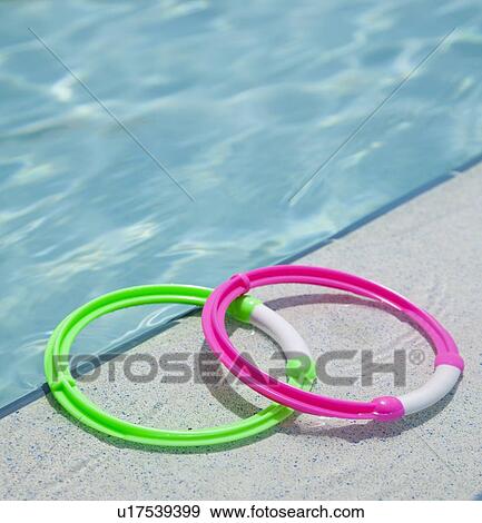 USA, Florida, St. Petersburg, two rings on poolside View Large Photo Image Stock Photo - USA, Florida, St. Petersburg, two rings on poolside. Fotosearch