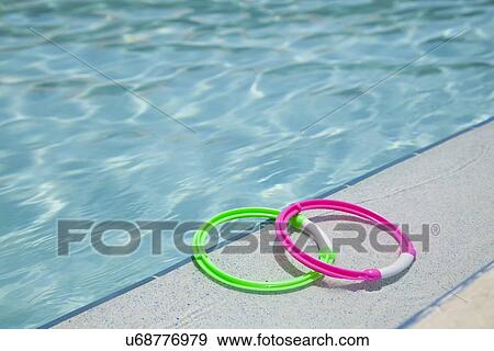 USA, Florida, St. Petersburg, two rings on poolside View Large Photo Image Stock Photo - USA, Florida, St. Petersburg, two rings on poolside. Fotosearch