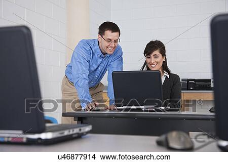 Picture - USA, Illinois, Metamora, Adult students in computer lab. Fotosearch