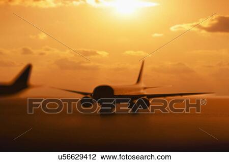 USA, Illinois, Metamora, Airplanes on runway at sunset View Large Photo Image Stock Image - USA, Illinois, Metamora, Airplanes on runway at sunset. Fotosearch