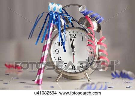 Picture - USA, Illinois, Metamora, Alarm clock showing two minutes to midnight. Fotosearch