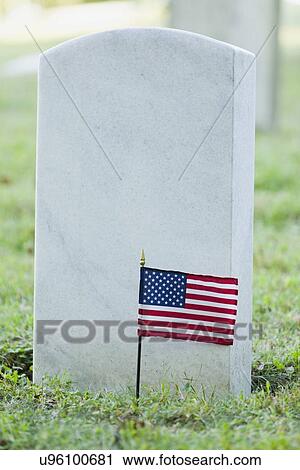 Stock Image - USA, Illinois, Metamora, American flag on cemetery. Fotosearch