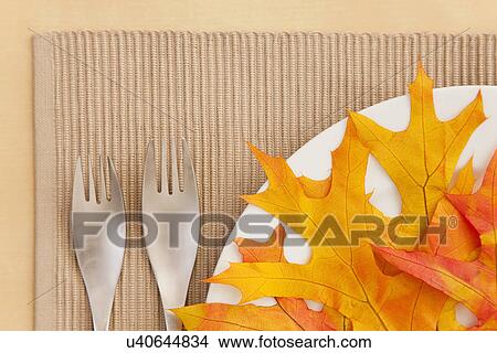 Picture - USA, Illinois, Metamora, Autumn leaves on plate. Fotosearch
