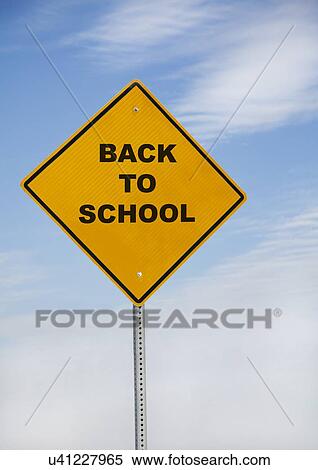 Stock Photography - USA, Illinois, Metamora, back to school sign against sky. Fotosearch