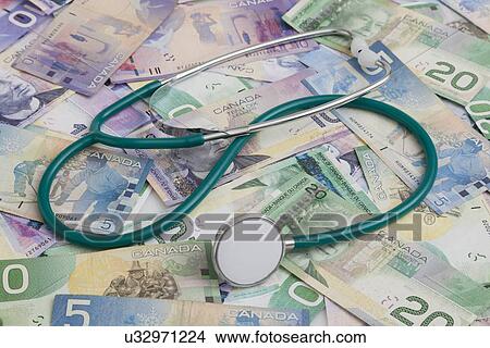 Picture - USA, Illinois, Metamora, Banknotes and stethoscope. Fotosearch
