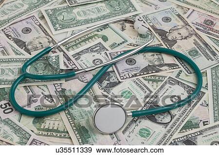 USA, Illinois, Metamora, Banknotes and stethoscope View Large Photo Image Stock Photo - USA, Illinois, Metamora, Banknotes and stethoscope. Fotosearch