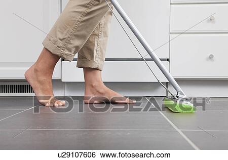USA, Illinois, Metamora, Barefoot woman cleaning kitchen floor, low section View Large Photo Image Stock Photograph - USA, Illinois, Metamora, Barefoot woman cleaning kitchen floor, low section. Fotosearch