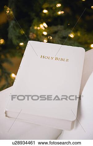 USA, Illinois, Metamora, Bible by Christmas tree View Large Photo Image Stock Image - USA, Illinois, Metamora, Bible by Christmas tree. Fotosearch