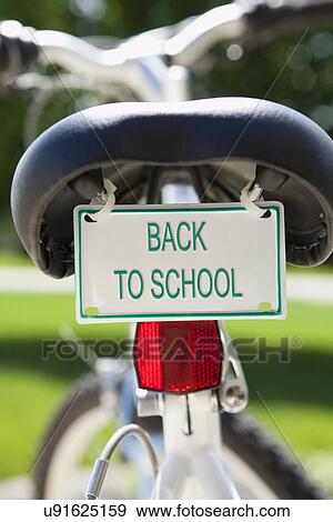 Stock Photo - USA, Illinois, Metamora, Bicycle with 'back to school' sign. Fotosearch